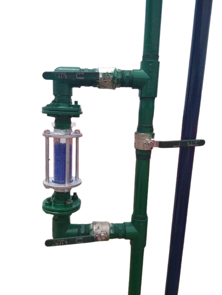 Silica gel breather jar installed on pipework, the chamber holding blue indicating gel
